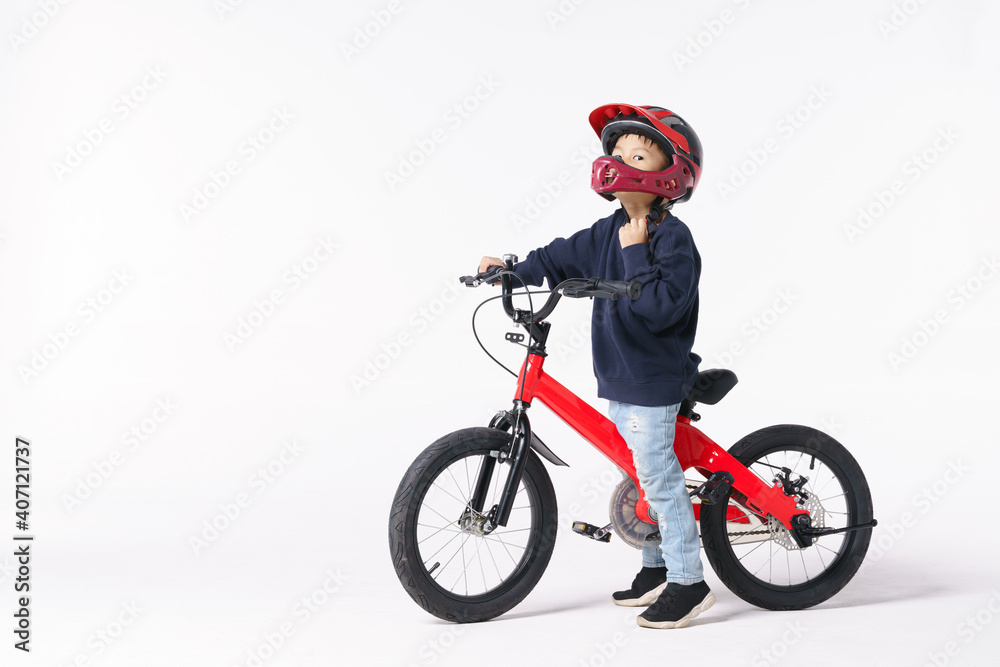 Fototapeta premium Asian boy wearing safety helmet for a bicycle ride
