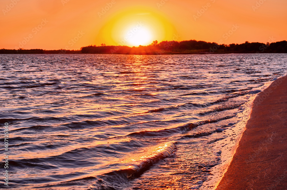 Waves in the river at sunset