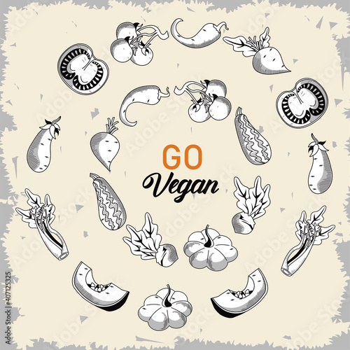 go vegan lettering poster with vegetables around