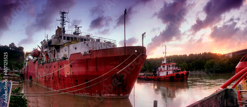 decay boat tied on the river