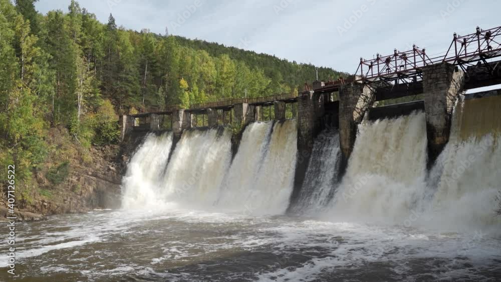 Water flow passing through the dam in slow motion Water flow passing through the dam in slow motion