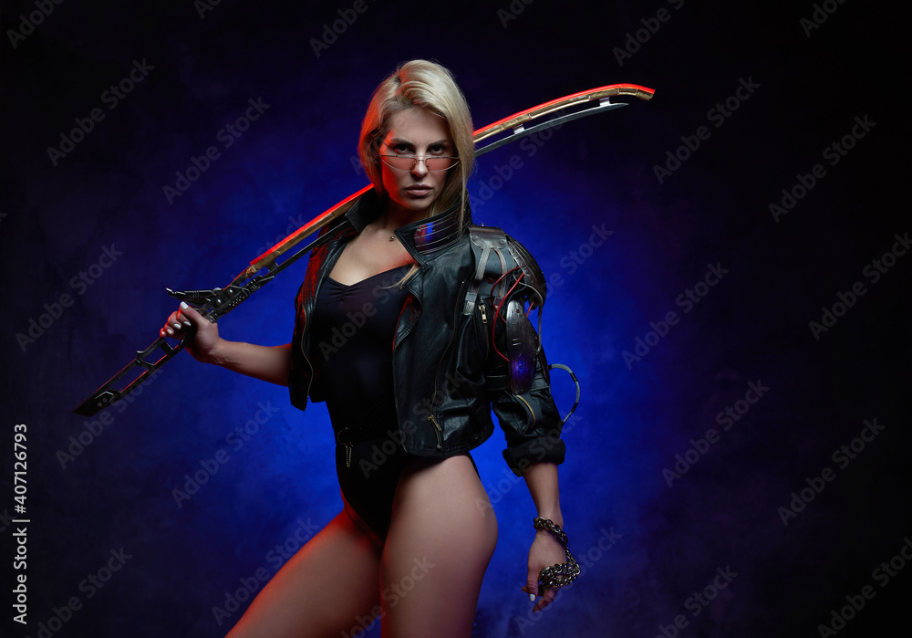 Sexual and cybernetic woman soldier with blond hairs dressed in black leather jacket and holding blade.