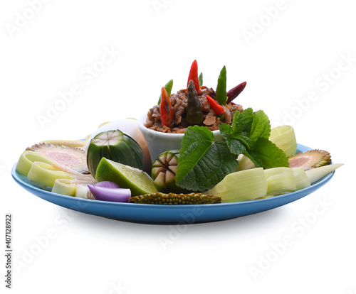 Fermented fried freshwater bream called Daging Pekasam in a plate on table. A traditional food in Malaysia. Marinade the fish in salt and covered it with rice powder for several weeks. photo