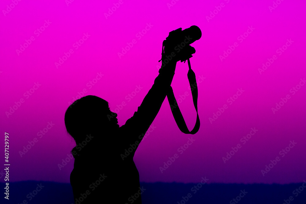 Female photographer, young reporter, Silhouette of female photographer during sunset