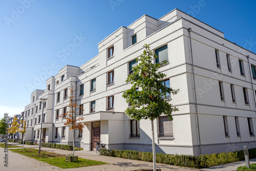 Street with modern white townhouses in Berlin, Germany