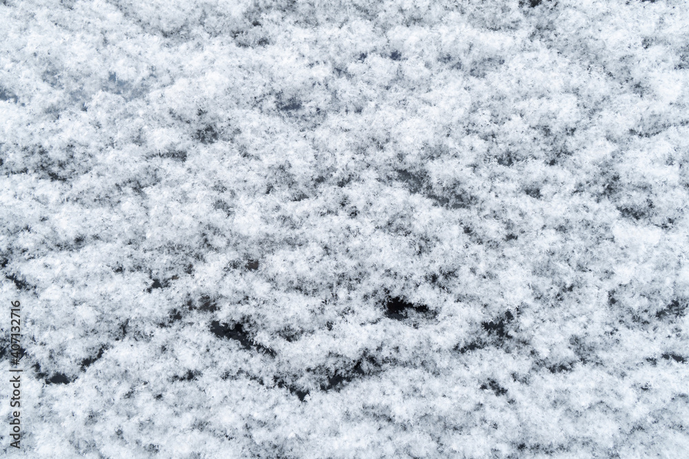 Fototapeta premium Background of fresh white snow. Winter snowflakes texture. Snow white texture winter background. Icy surface pattern. Shiny snow with bokeh