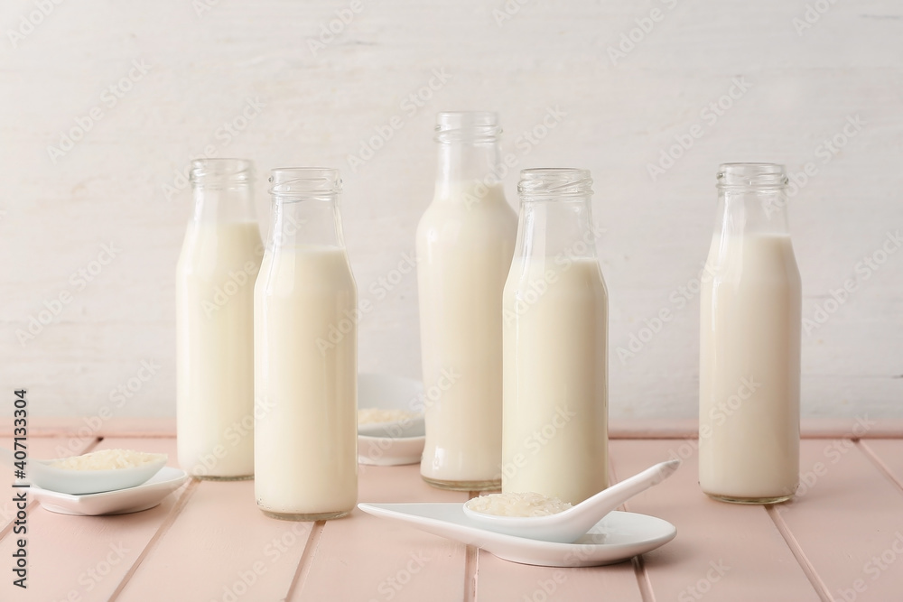 Bottles of rice milk on table Bottles of rice milk on table