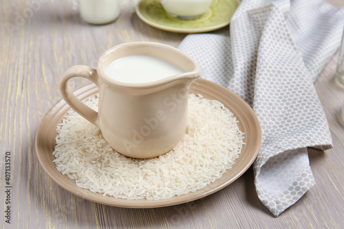 Jug of rice milk on table