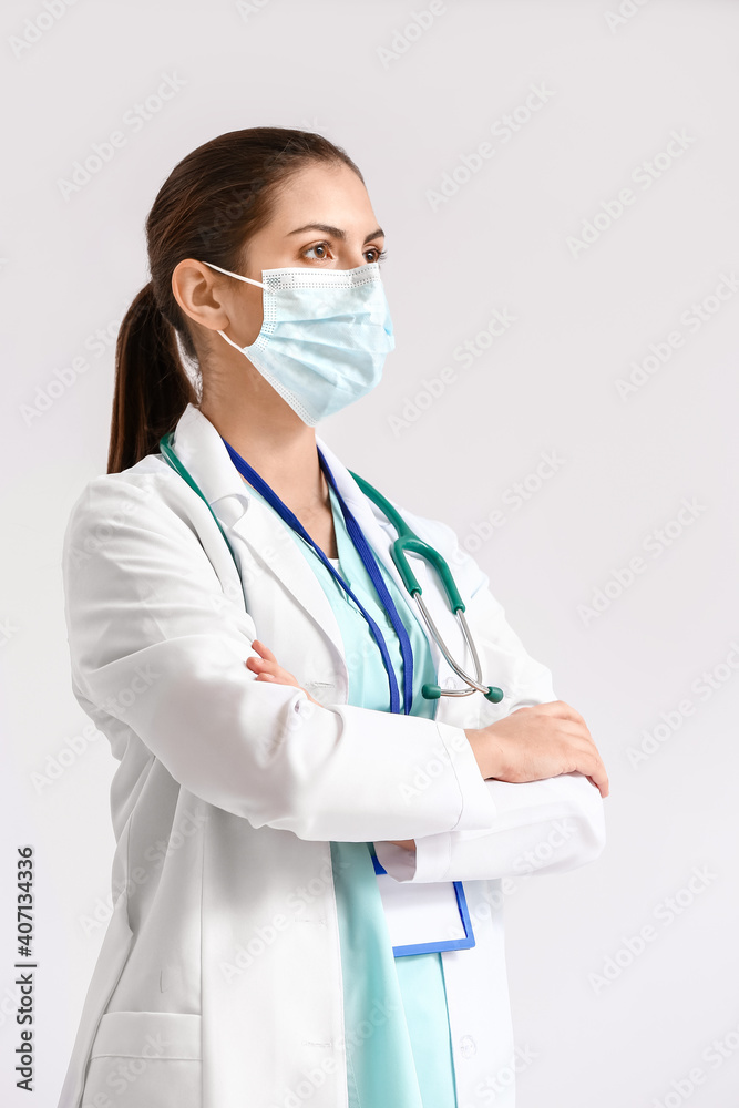 Portrait of female doctor on light background Portrait of female doctor on light background