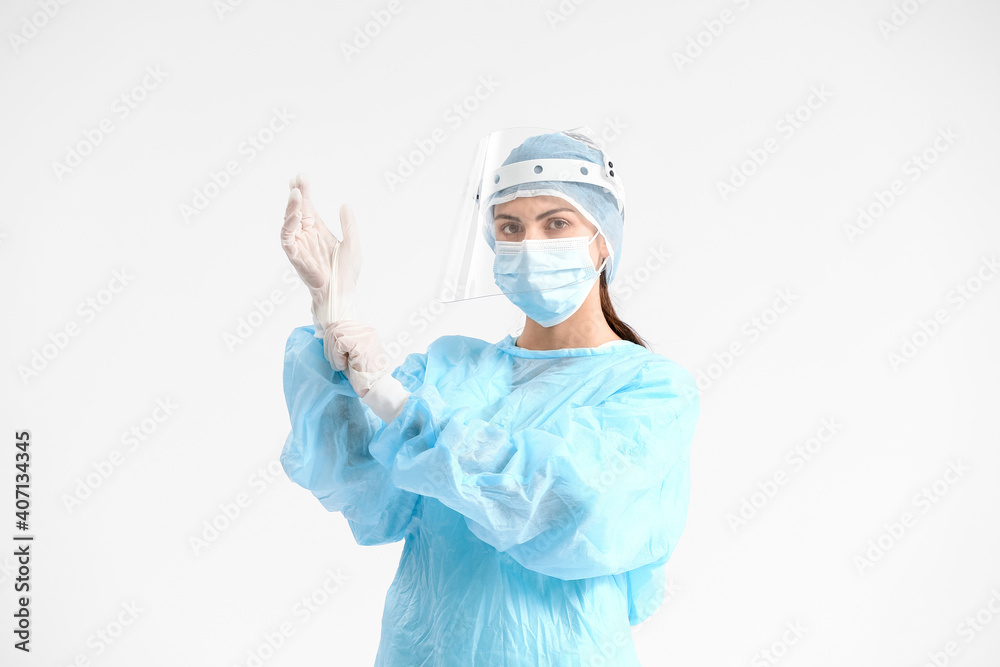 Portrait of female surgeon on light background Portrait of female surgeon on light background