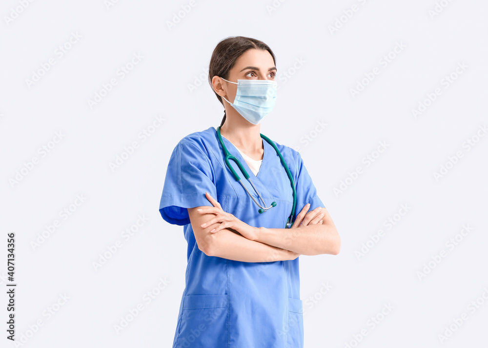 Portrait of female doctor on light background Portrait of female doctor on light background