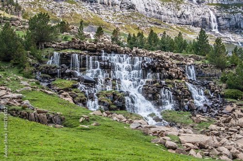 Ruta de senderismo de la cola de Caballo por el río con cascadas. Torla, parque nacional de Ordesa y Monte Perdido photo