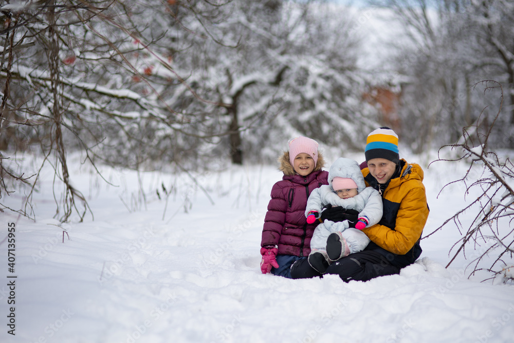 Three children on a walk in winter, a teenager Three children on a walk in winter, a teenager