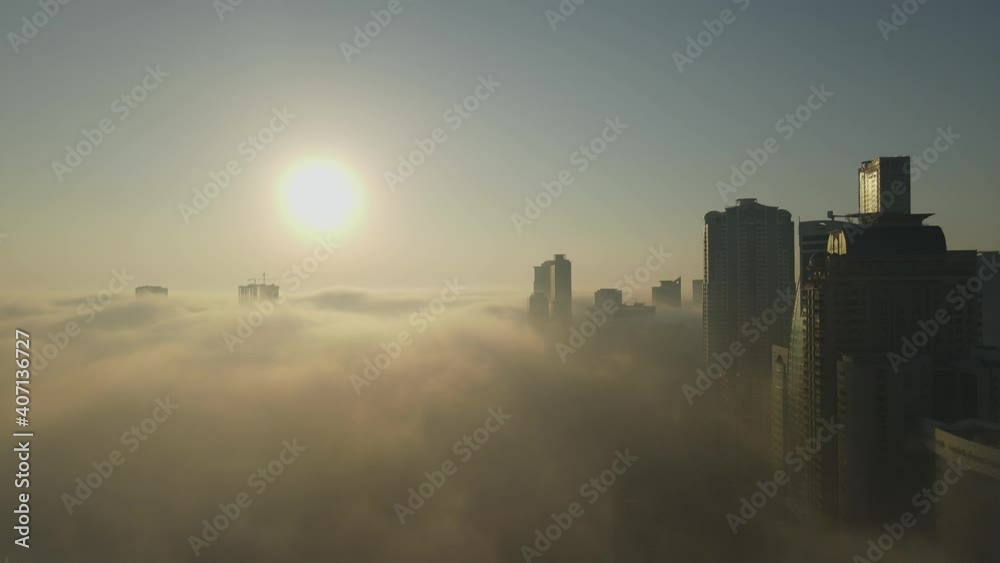 Aerial view of Fog over Sharjah, Sharjah skyline covered in the winter morning fog, United Arab Emirates, 4K Drone Footage Aerial view of Fog over Sharjah, Sharjah skyline covered in the winter morning fog, United Arab Emirates, 4K Drone Footage