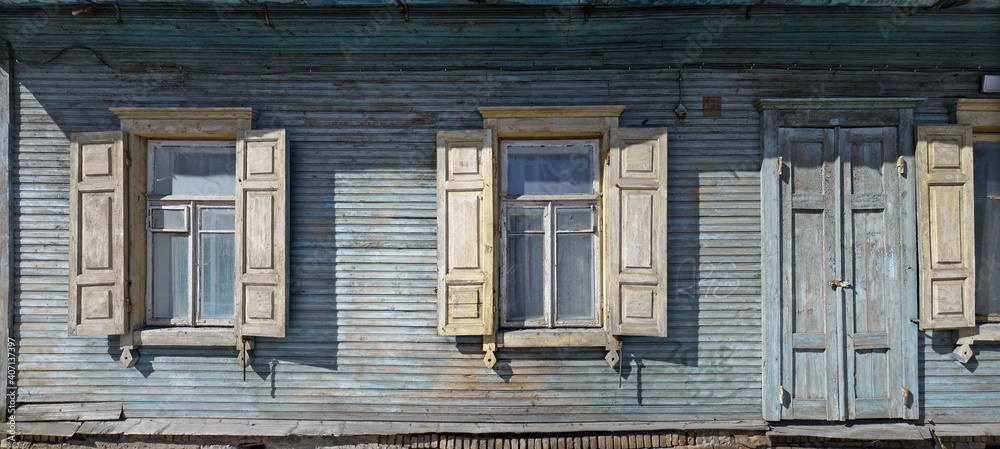 Windows with an open sun blinds and door in broken rural home. Windows with an open sun blinds and door in broken rural home.