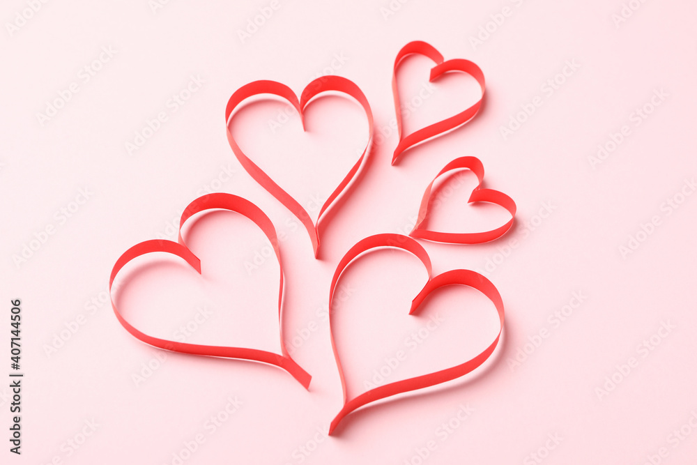 Concept of Valentine's day with decorative hearts on pink background Concept of Valentine's day with decorative hearts on pink background