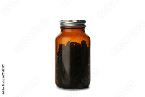 Medical bottle with spirulina pills isolated on white background
