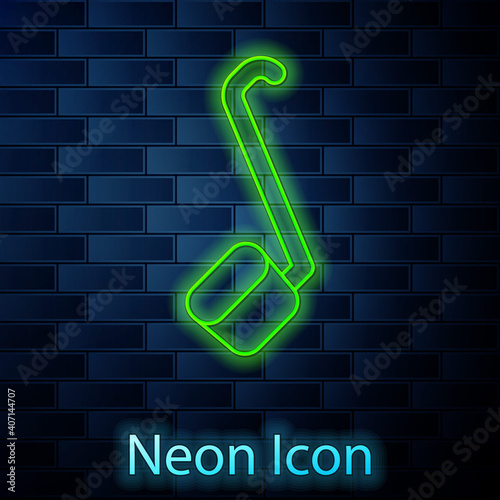 Glowing neon line Sauna ladle icon isolated on brick wall background. Vector.
