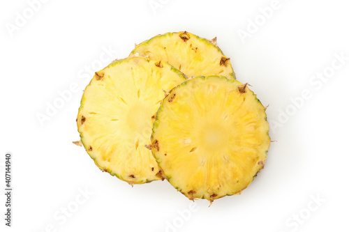 Ripe pineapple slices isolated on white background