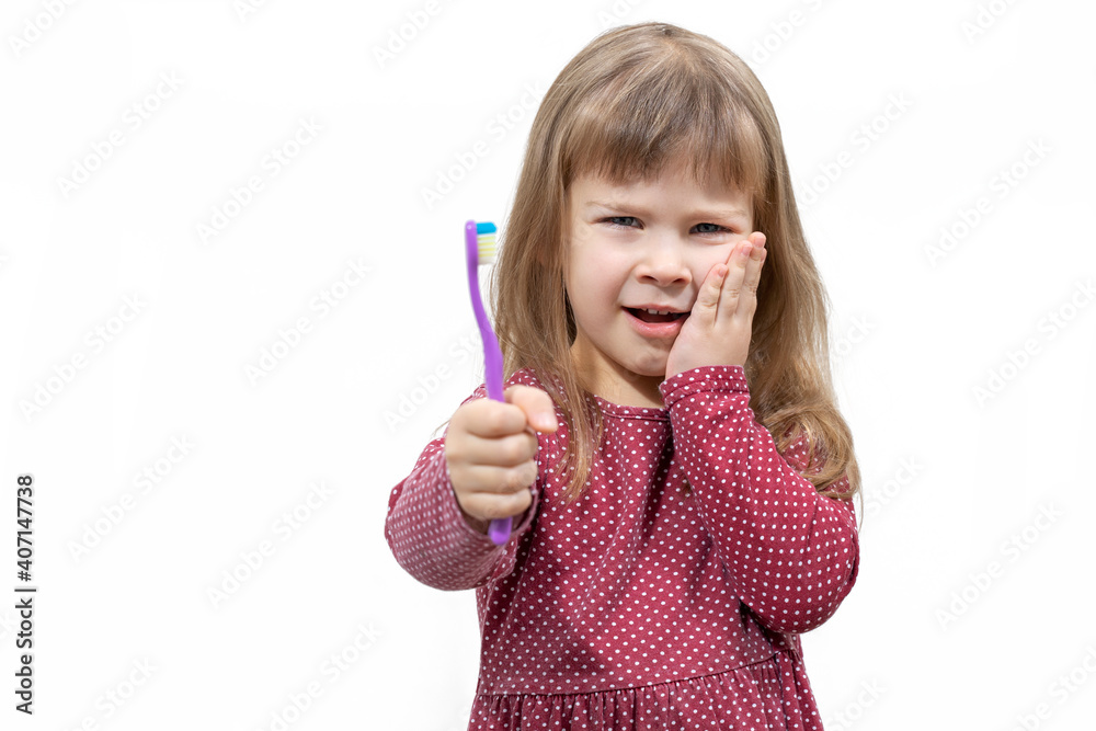 child has pain when brushing teeth. isolate on white background child has pain when brushing teeth. isolate on white background