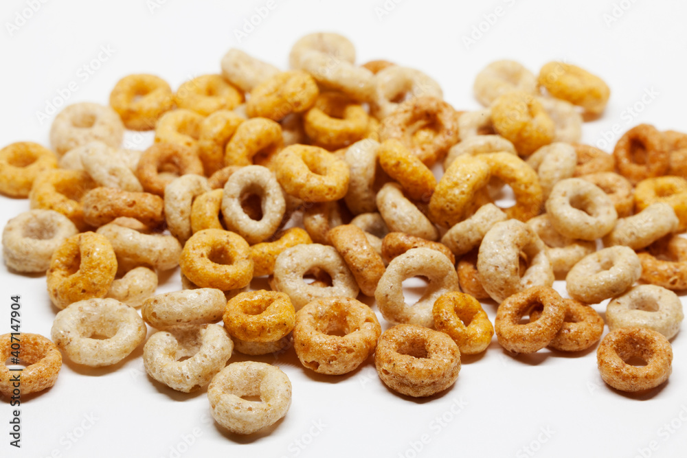 round breakfast cereals on white background seen from above