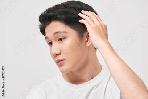 Fényképezés Young handsome man wearing white t-shirt over isolated background Smiling confid