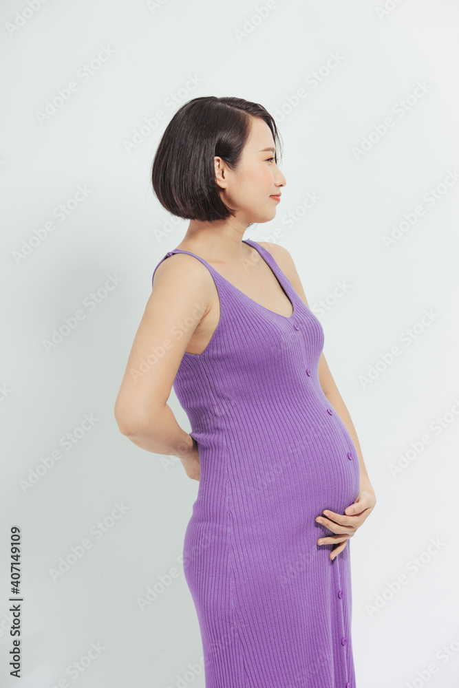 Young smiling beautiful pregnant woman in dress Young smiling beautiful pregnant woman in dress