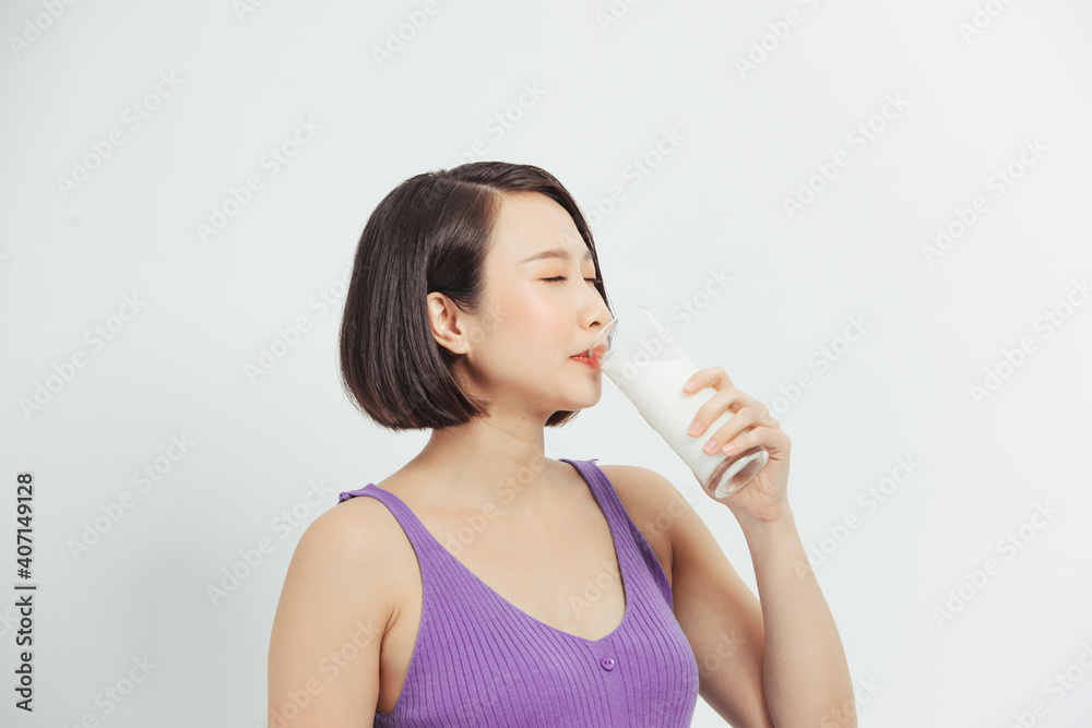 Pregnant woman with glass of milk showing thumb up copy space. Pregnant woman with glass of milk showing thumb up copy space.