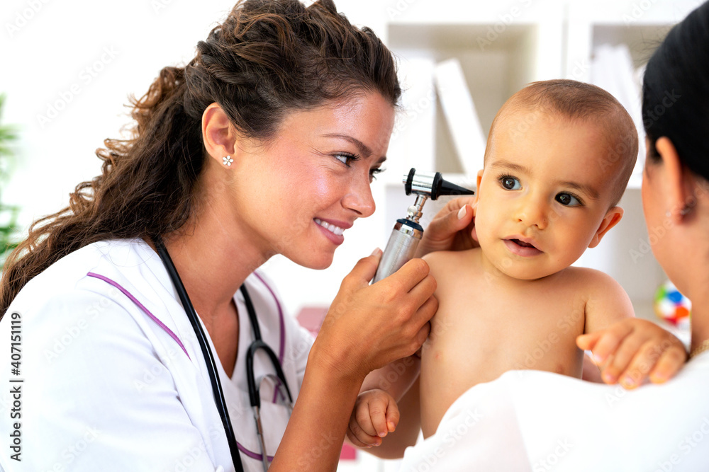 Pediatrician providing healthcare for her baby patient Pediatrician providing healthcare for her baby patient