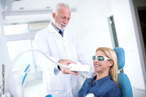 Dentist prepares a teeth whitening device