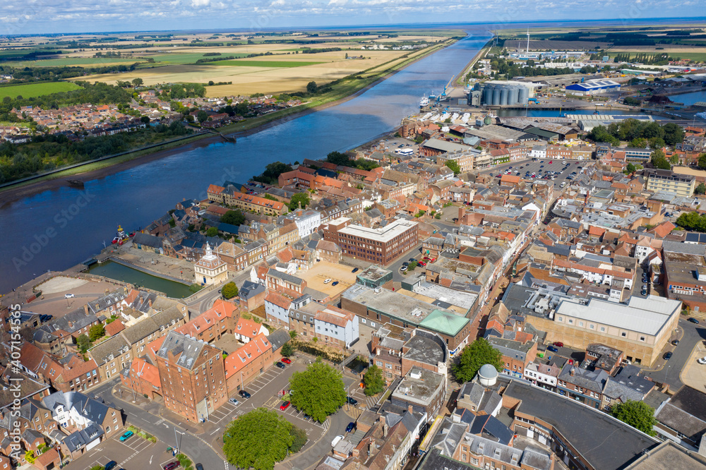 Aerial photo of the beautiful town of King's Lynn a seaport and market town in Norfolk, England UK showing the main town centre along side the River Great Ouse on a sunny summers day