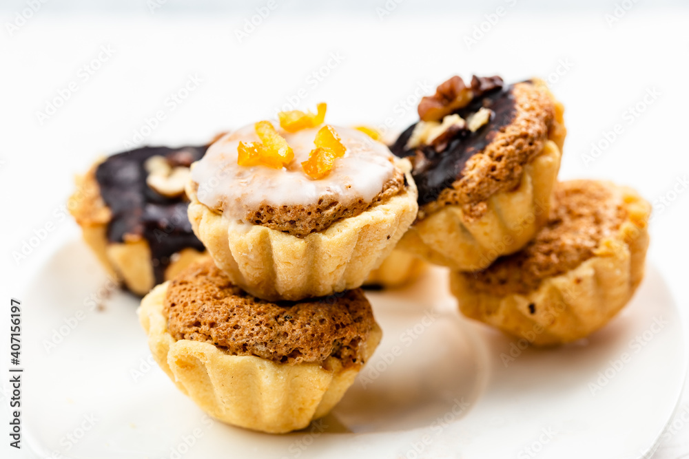 Sweet mini tart served on white plate Sweet mini tart served on white plate