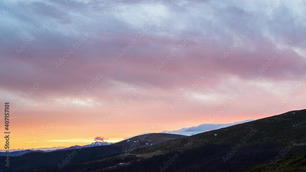 Time lapse with beautiful fast-moving clouds over the tree-covered mountain slopes at sunrise, Balkan mountains in Bulgaria. Time lapse with beautiful fast-moving clouds over the tree-covered mountain slopes at sunrise, Balkan mountains in Bulgaria.