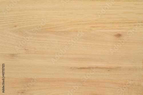 Acacia natural wooden desk without paint or  varnish.  Wood texture background made from locust tree. photo