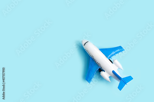 Toy airplane on a blue pastel background. Model plane.