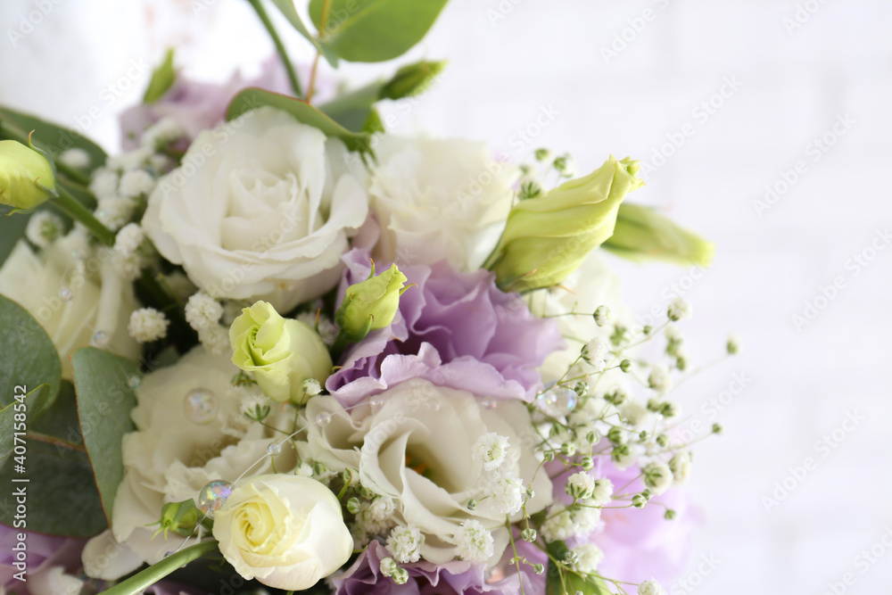 Beautiful wedding bouquet with Eustoma flowers on light background, closeup