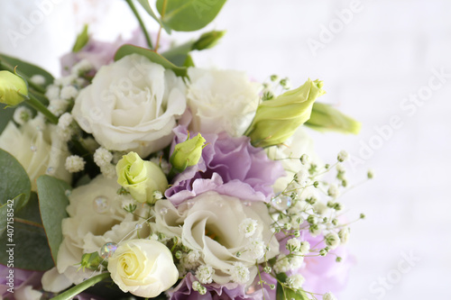 Beautiful wedding bouquet with Eustoma flowers on light background  closeup