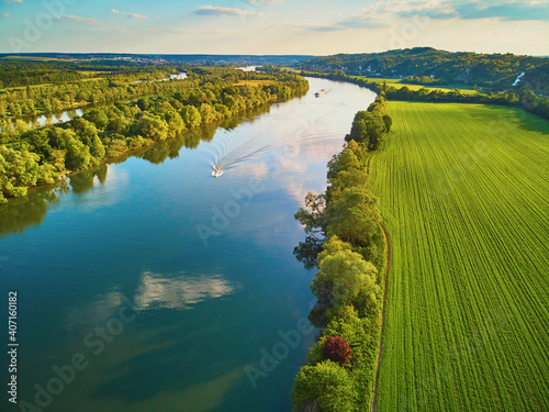 Scenic aerial view of the Seine river and green fields in French countryside photo