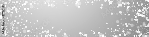 Magic stars sparse Christmas background. Subtle flying snow flakes and stars on grey background. Captivating winter silver snowflake overlay template. Flawless panoramic illustration.