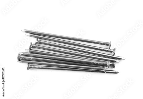 Pile of metal nails on white background, top view