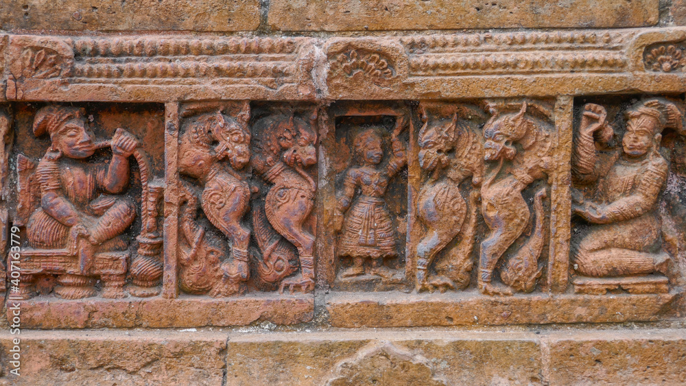 Detail of man with hookah and mythological creatures : intricate terracotta carving at Kantaji aka Kantajew medieval hindu temple in Kantanagar, Dinajpur, Bangladesh