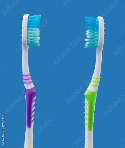Couple concept with two toothbrushes facing each other