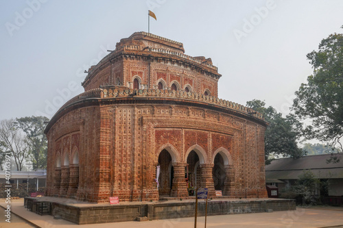 Side view of beautiful Kantaji aka Kantajew medieval terracotta hindu temple in Kantanagar, Dinajpur district, Bangladesh photo