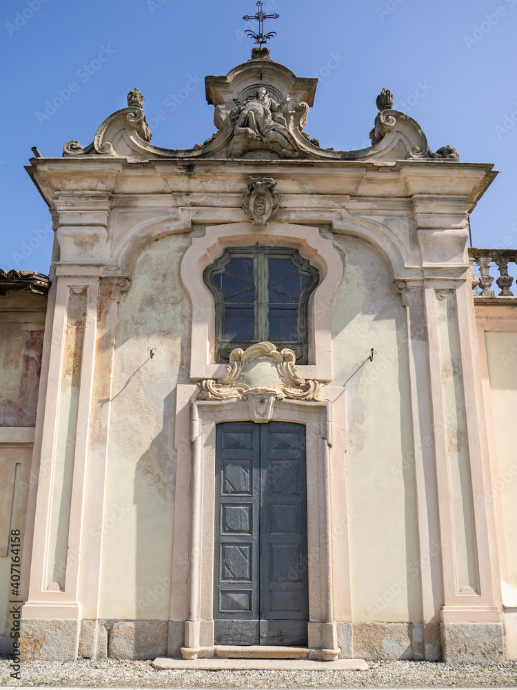 Fototapeta premium ancient villa Visconti Castiglioni on the cycle-pedestrian path that runs along the Naviglio, artificial historic canal, in the countryside outside Milan.Lombardy, Italy.