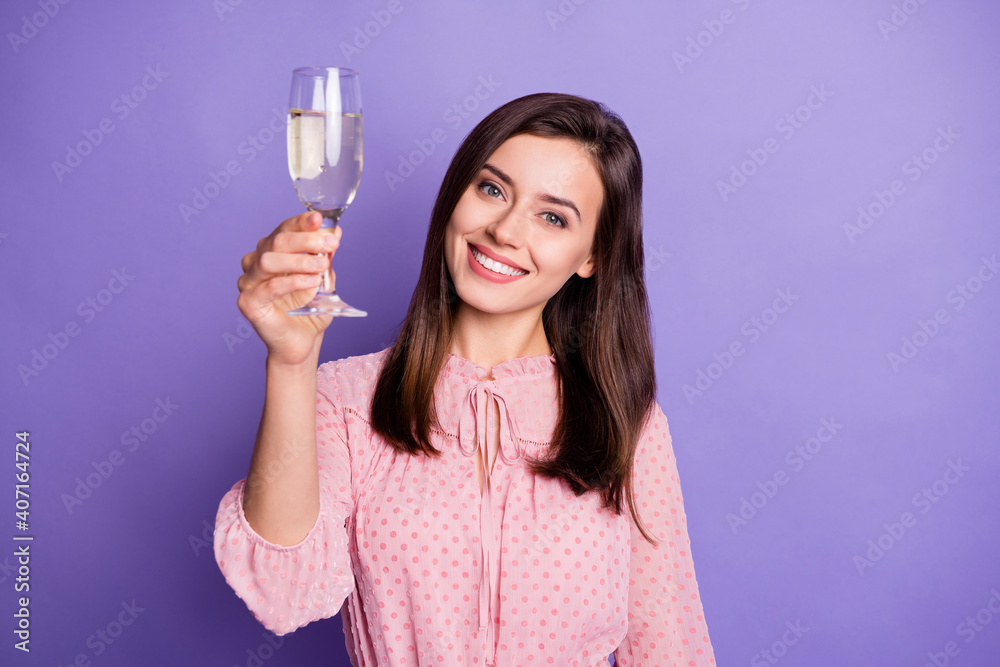Photo of gorgeous young girl hand hold raise champagne glass wear retro clothing isolated on purple color background Photo of gorgeous young girl hand hold raise champagne glass wear retro clothing isolated on purple color background
