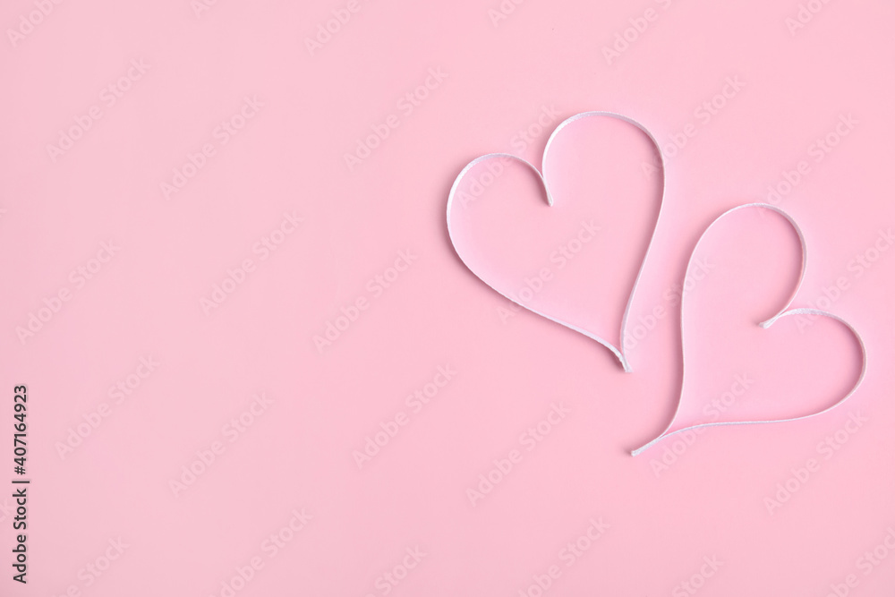 Hearts made of white ribbon on pink background, flat lay with space for text. Valentine's day celebration
