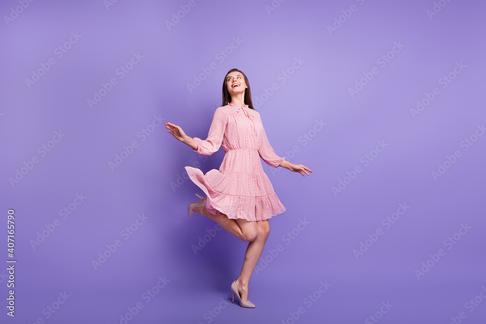 Full size photo of pretty person look empty space dance wear retro outfit isolated on purple color background