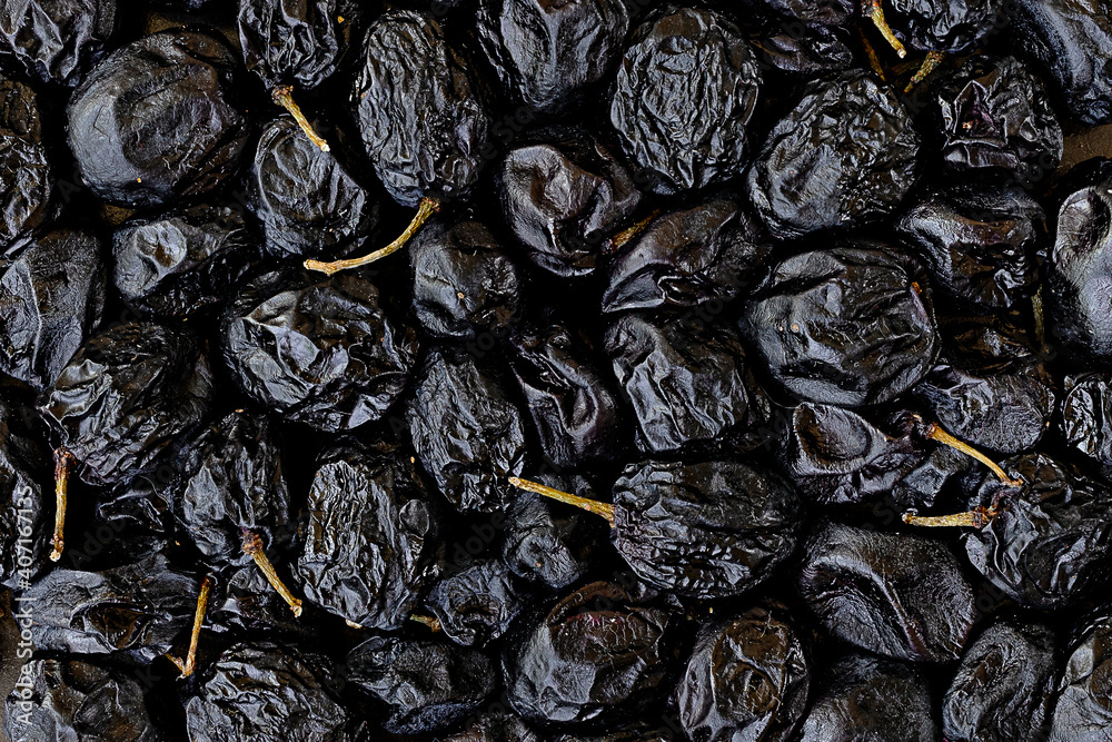 close-up topview photo of dried dark grapes as a background close-up topview photo of dried dark grapes as a background