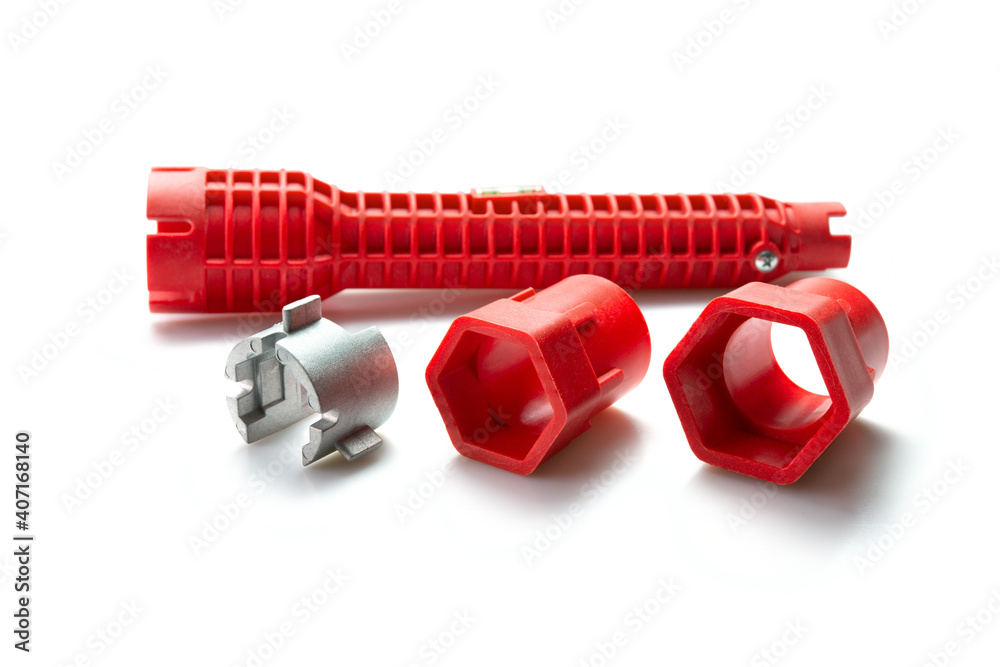 Pipe wrench, Multifunctional tool for common faucet installations and sink strainers over white background. Pipe wrench, Multifunctional tool for common faucet installations and sink strainers over white background.