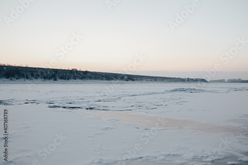 Landscape with frozen water  ice and snow on the  river during winter.
